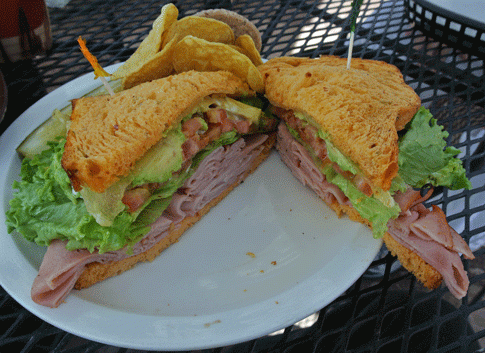 Ham and Swiss toasted with avocado on the famous New Mexico Green Chile bread